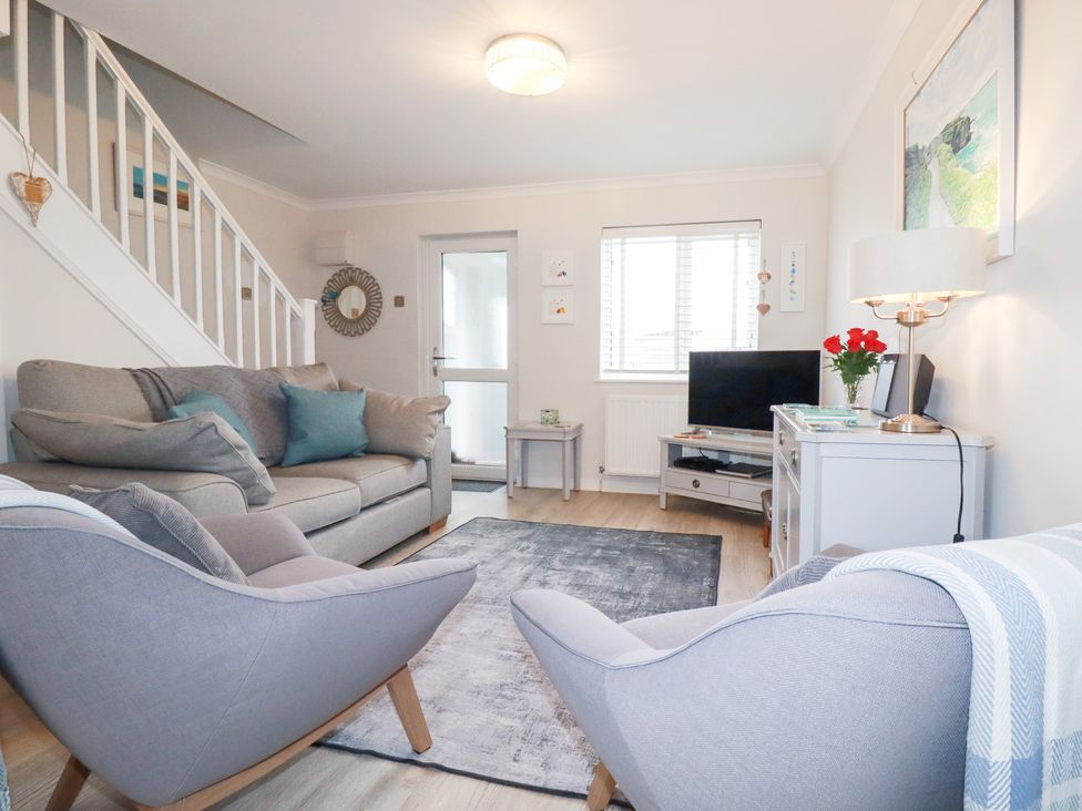 A living room with furniture and television at Gull Cottage Padstow