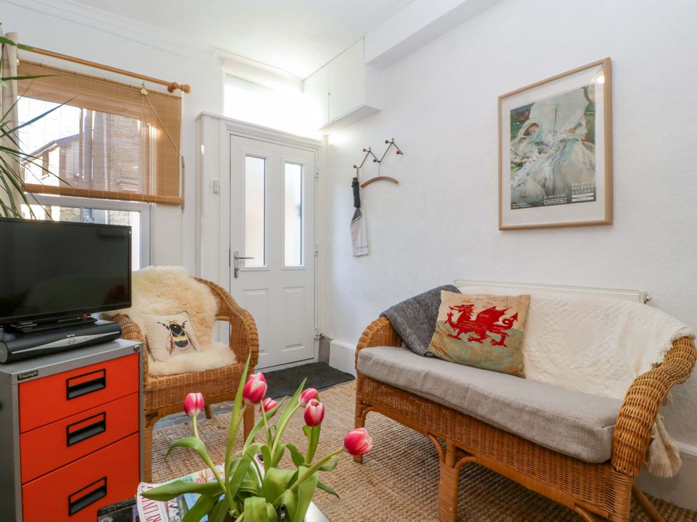 A living room with television and seating area at 7 Bell Street in Talgarth