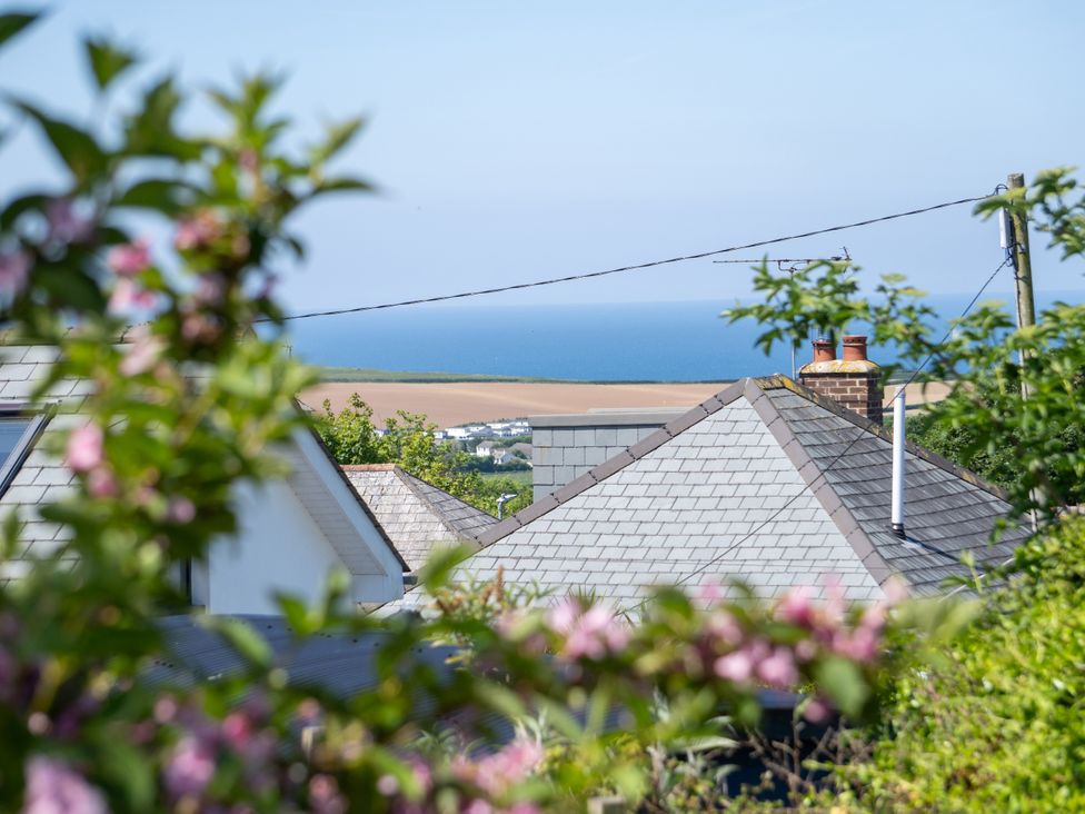 A view of rooftops and the sea at Easterly Cottage in Bude
