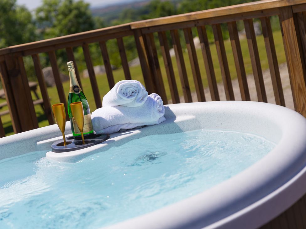 A hot tub with towels and champagne at Costentyn, Tor Down Quarry St Breward