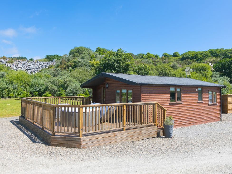 A log cabin with a deck at Costentyn, Tor Down Quarry St Breward