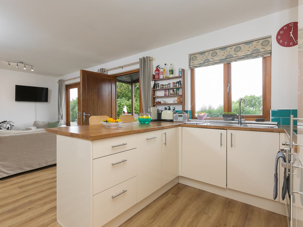 A kitchen with a sink and counter at Tressa, Tor Down Quarry St Breward