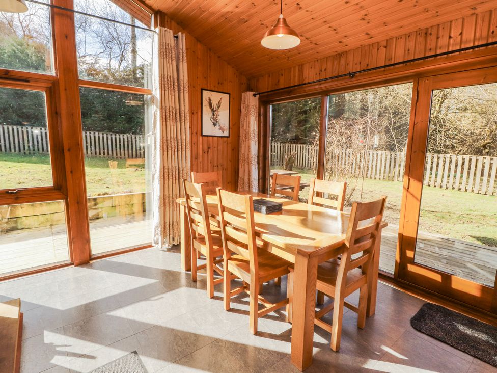 A dining room with a table and chairs at 26 Dukes Meadow Greystoke near Penrith