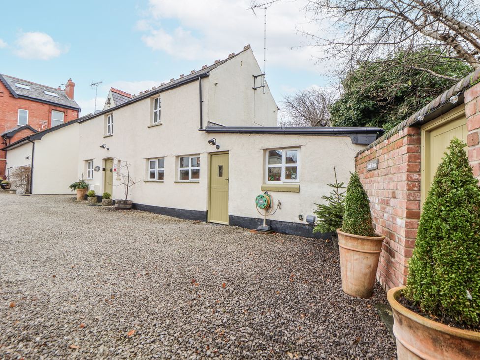 A house exterior with gravel area and plants at The Coach House in Prestatyn
