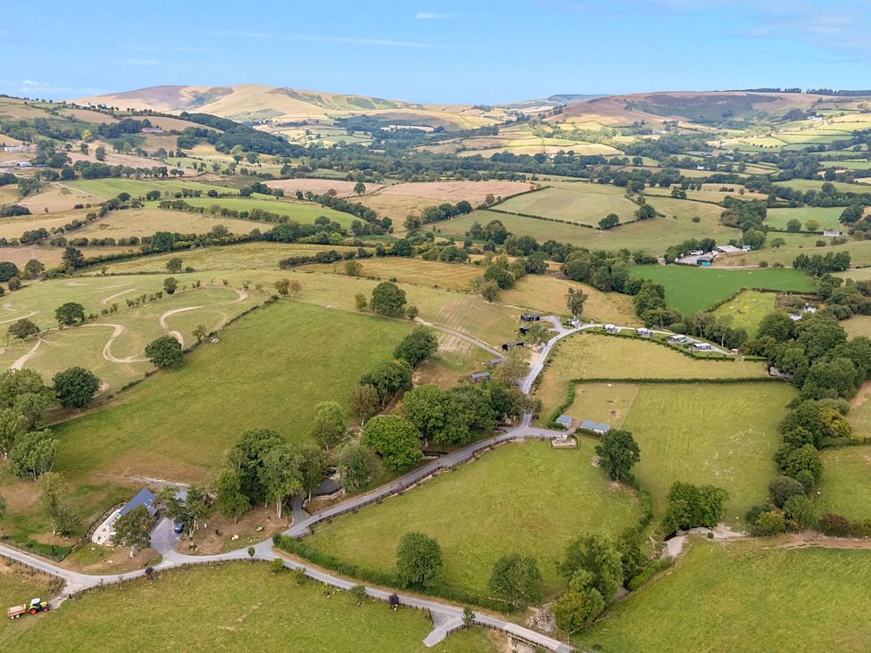 An aerial view of fields and hills at Hillside Lodge in Nantmel near Rhayader