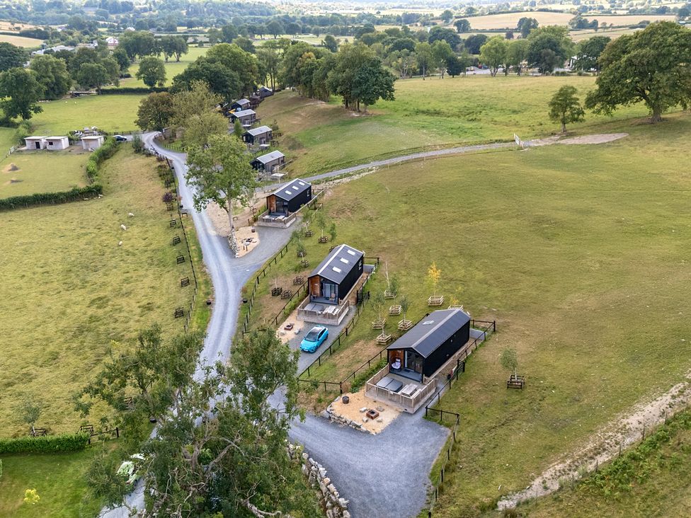An aerial view of cabins and surrounding landscape at Hillside Lodge in Nantmel near Rhayader