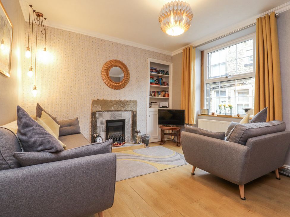 A living room with a television and fireplace at Lorna Loom in Skipton