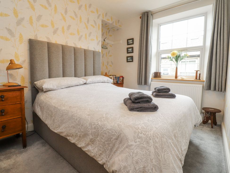 A bedroom with a bed and window at Lorna Loom in Skipton