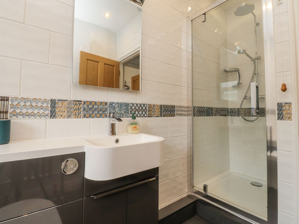 A bathroom with a shower and sink at Lorna Loom in Skipton