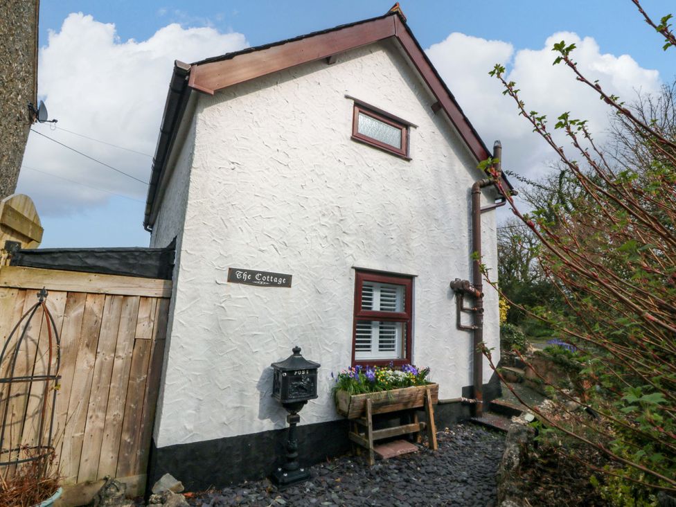 An outdoor view of The Cottage with a planter at The Cottage in Marian-Glas