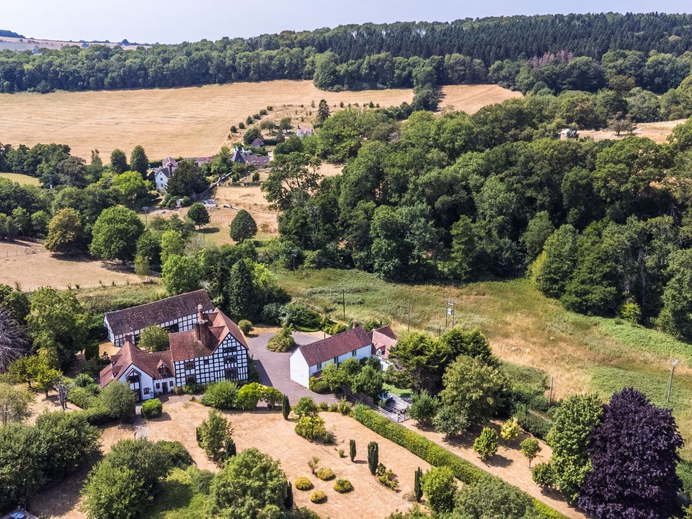 An aerial view of a property with gardens and fields at Lower Tundridge Cottage Suckley near Malvern