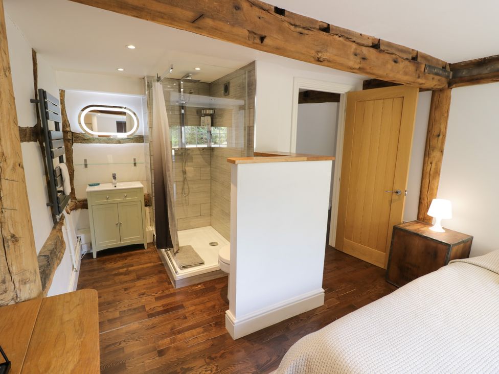A bathroom with a shower and sink at Lower Tundridge Cottage Suckley near Malvern