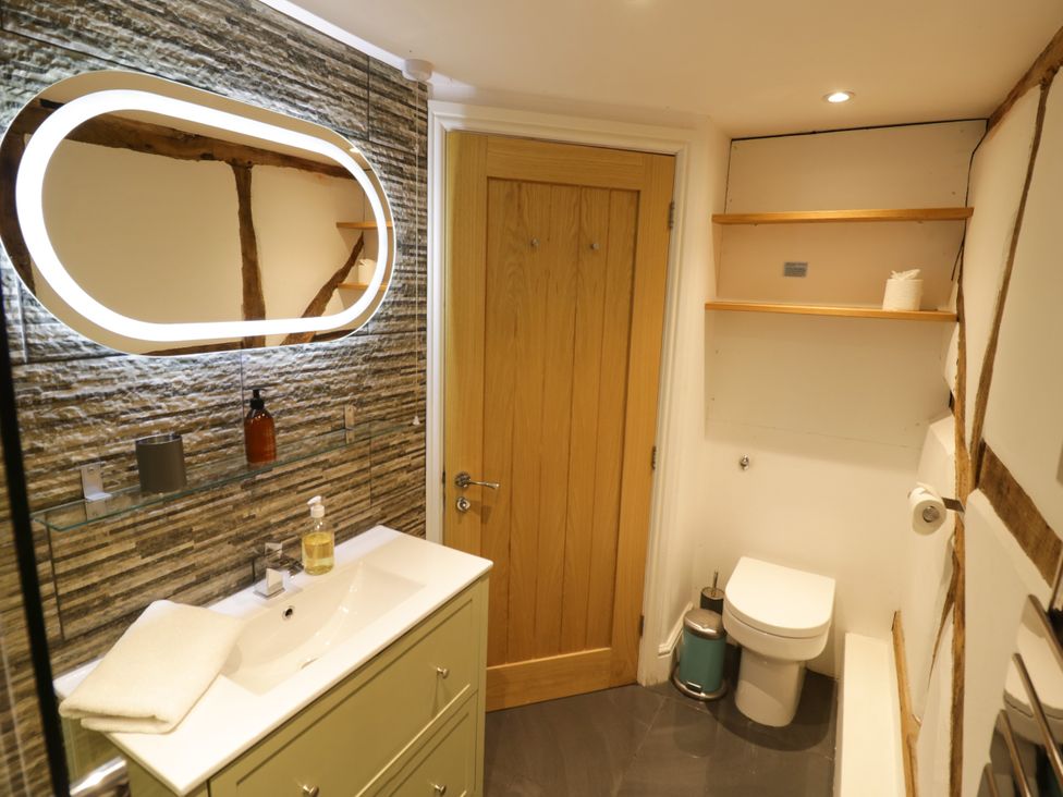 A bathroom with a sink and toilet at Lower Tundridge Cottage Suckley near Malvern