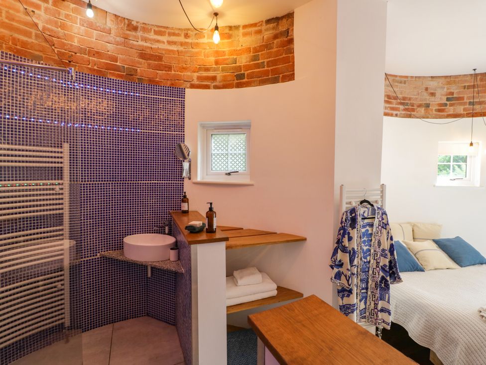 A bathroom with a shower and sink at Lower Tundridge Cottage Suckley near Malvern