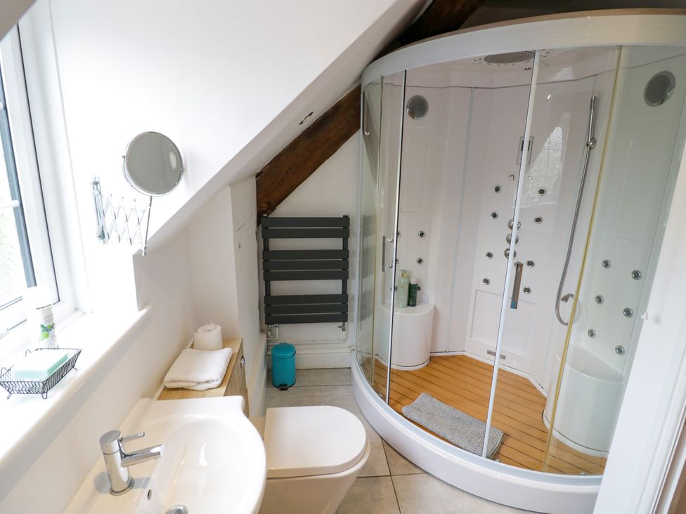 A bathroom with a shower and sink at Lower Tundridge Cottage Suckley near Malvern