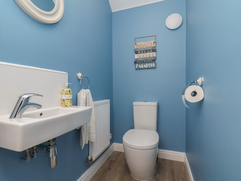 A bathroom with a sink and toilet at Coastal Cottage The Bay near Filey
