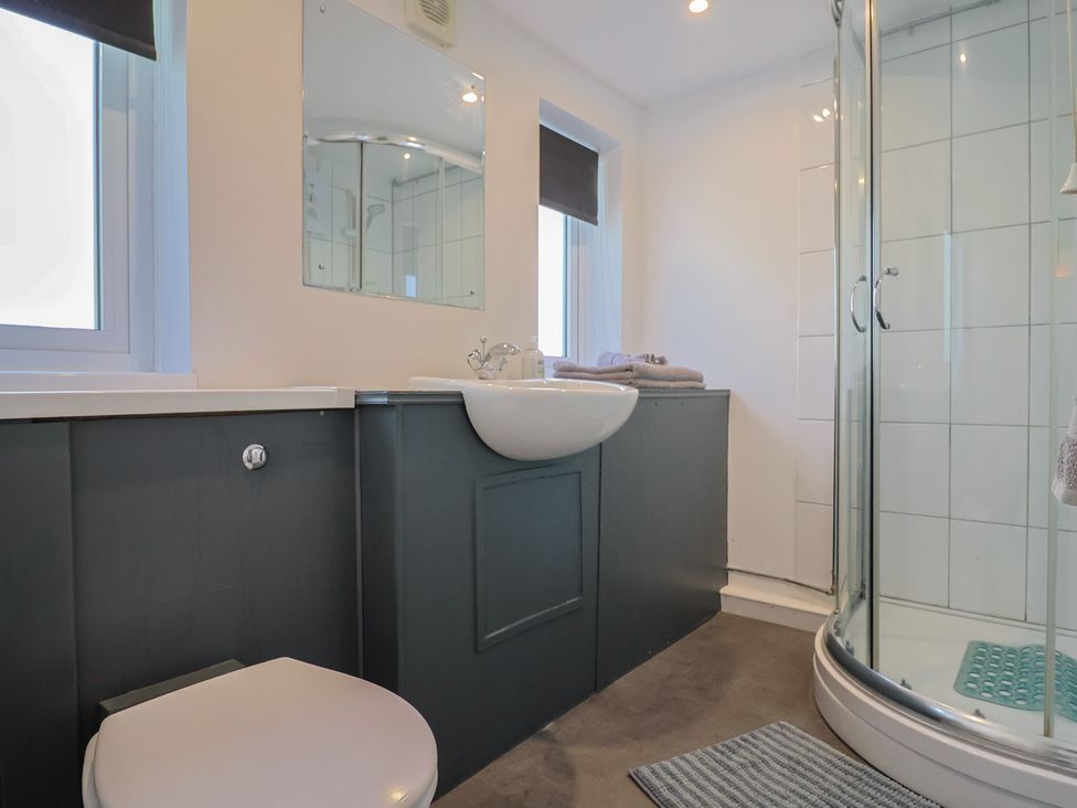 A bathroom with a shower and sink at Brookfield Lodge in Drimpton