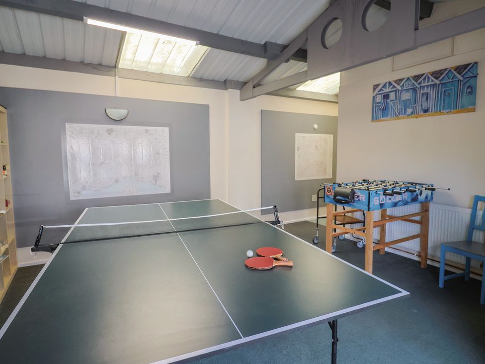 A games room with a table tennis table and foosball table at Brookfield Lodge Drimpton