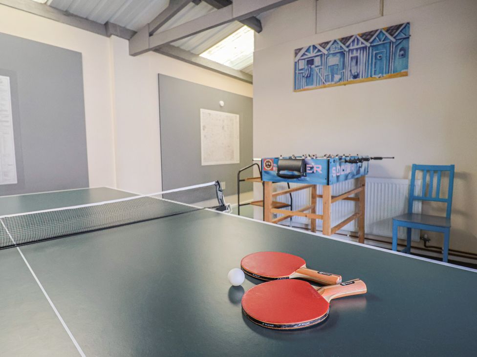 A game room with a table tennis table and foosball table at Brookfield Lodge Drimpton