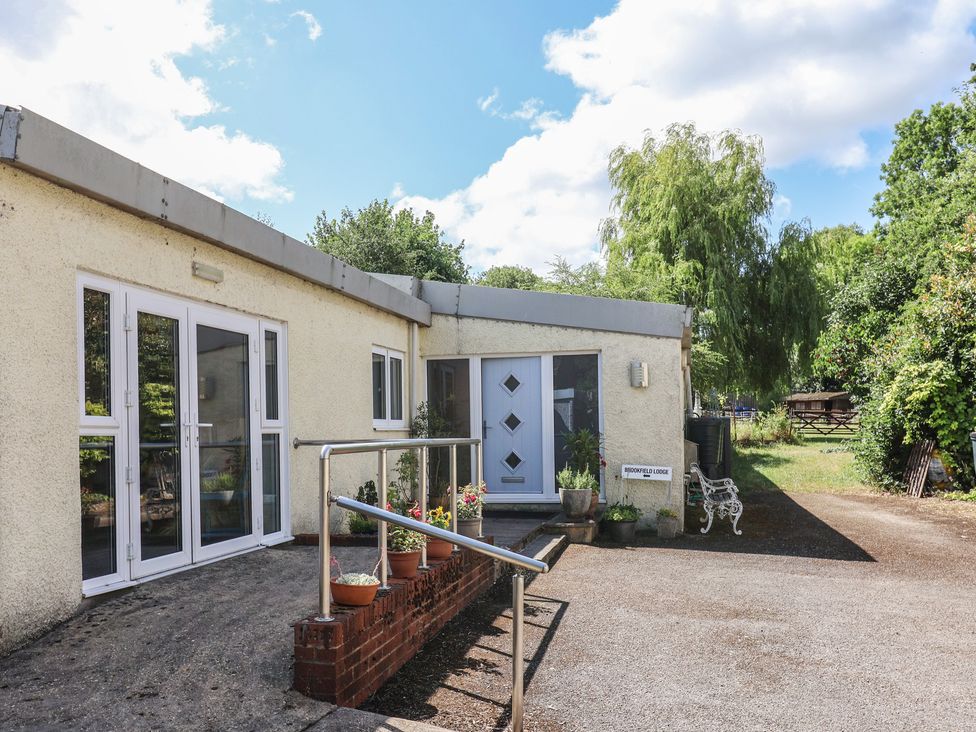 An outdoor area with a front entrance at Brookfield Lodge in Drimpton