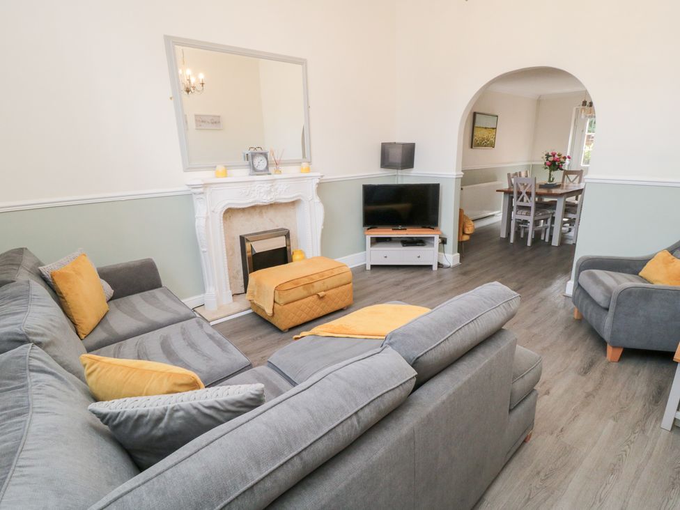 A living room with a sofa and television at Roseberry House in Guisborough