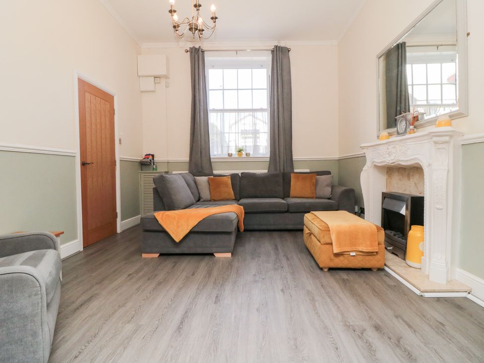 A living room with a sofa and footstool at Roseberry House in Guisborough