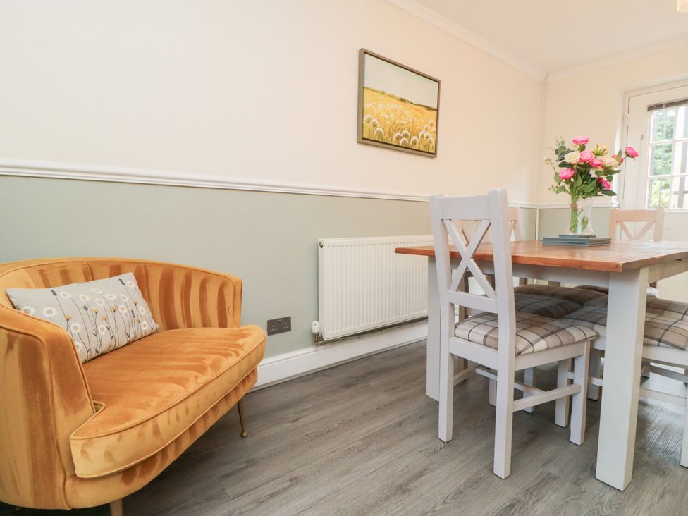 A dining room with a table and chairs at Roseberry House in Guisborough