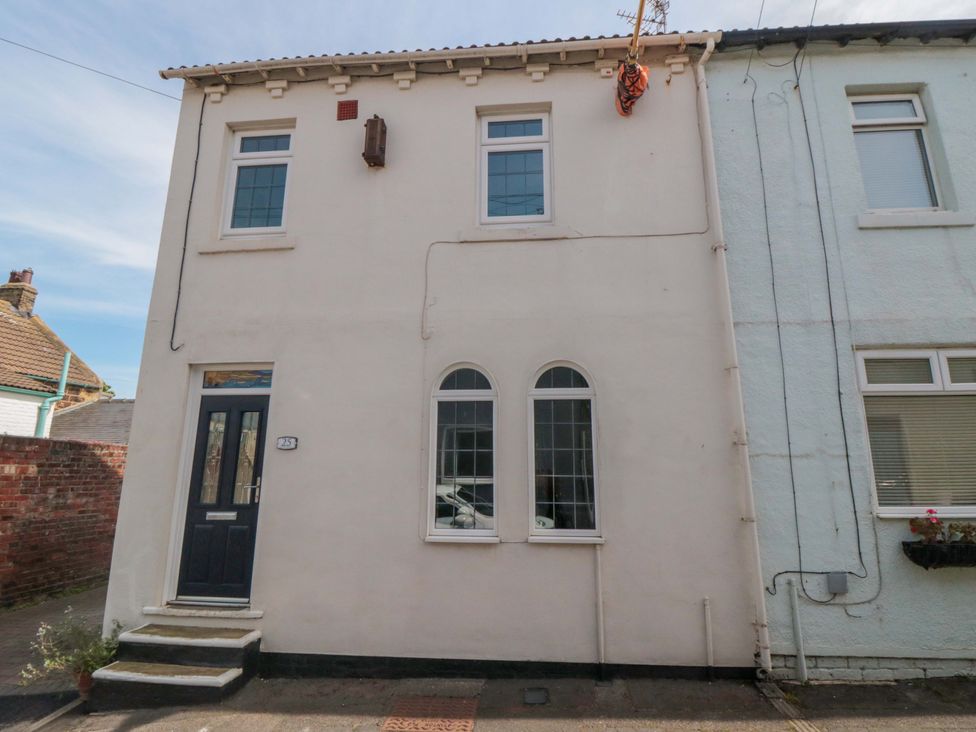 A house exterior with windows and front door at Sands End Cottage in Marske-by-the-Sea