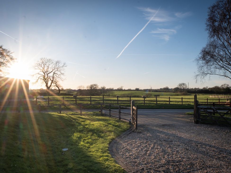 A view of fields and trees at Barnfields Holiday Cottage in Kingsley