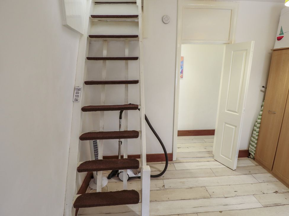 A staircase leading to an upper floor in Herby's Retreat Sutton-On-Sea