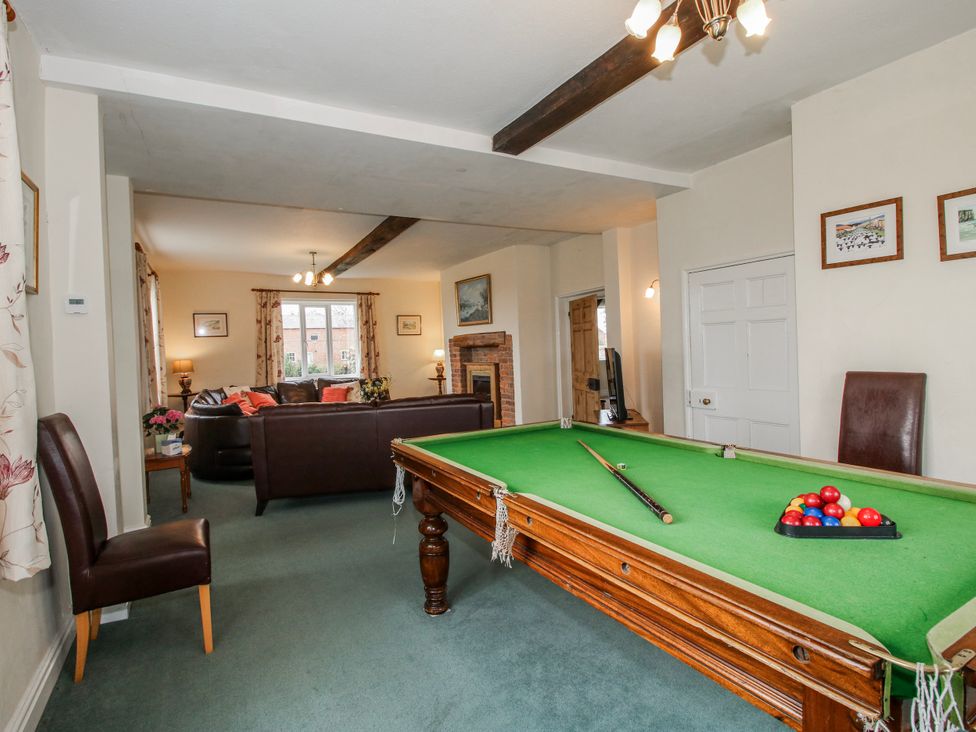A games room with a pool table and a sofa at The Manor House at Kenwick Lodge Cockshutt near Ellesmere
