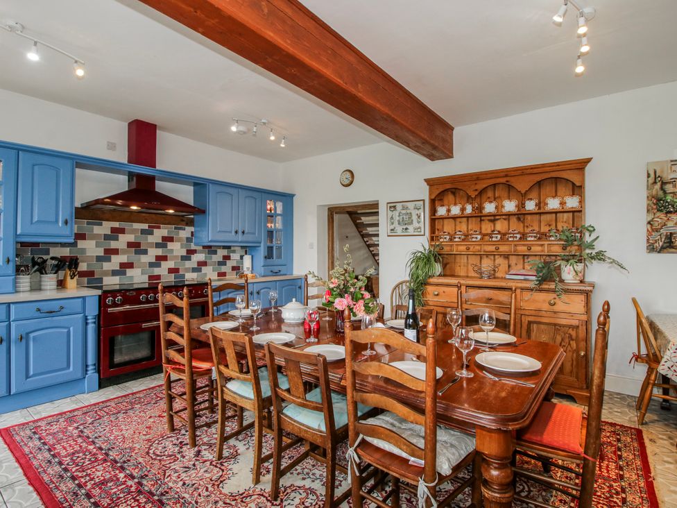 A kitchen with a dining table and chairs at The Manor House at Kenwick Lodge Cockshutt near Ellesmere