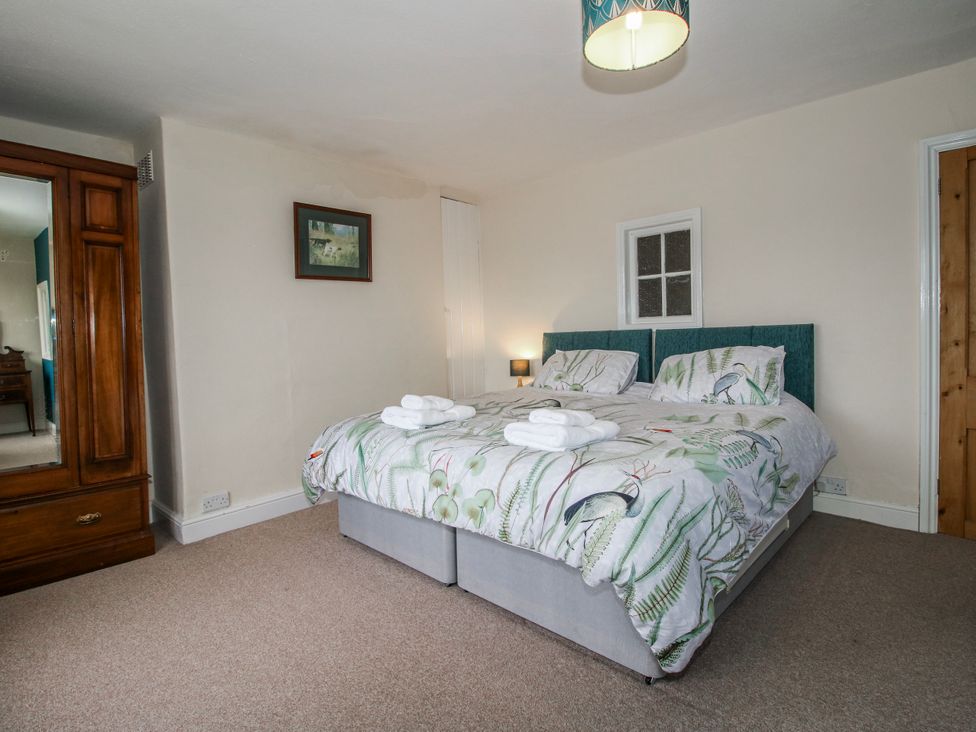 A bedroom with a double bed and wardrobe at The Manor House at Kenwick Lodge Cockshutt near Ellesmere