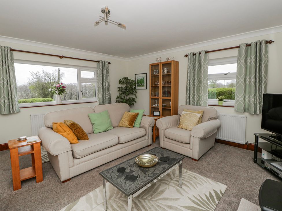 A living room with a sofa and armchairs at Blaenywawr near Lampeter