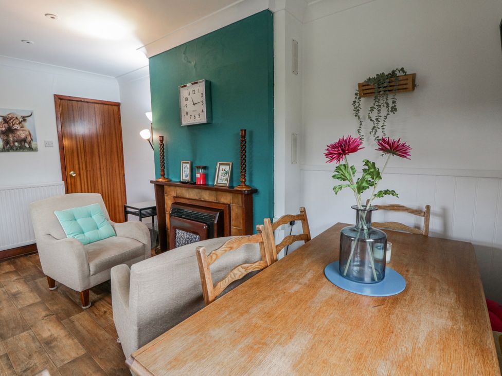 A dining room with a table and chairs at Blaenywawr near Lampeter
