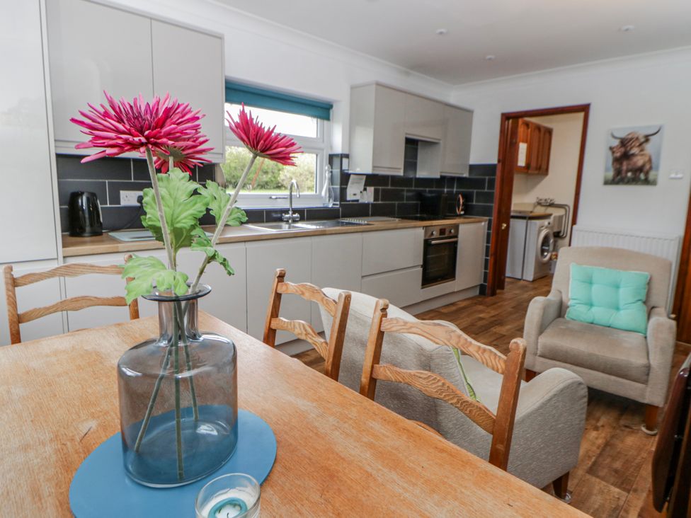 A kitchen with a dining table and chairs at Blaenywawr near Lampeter