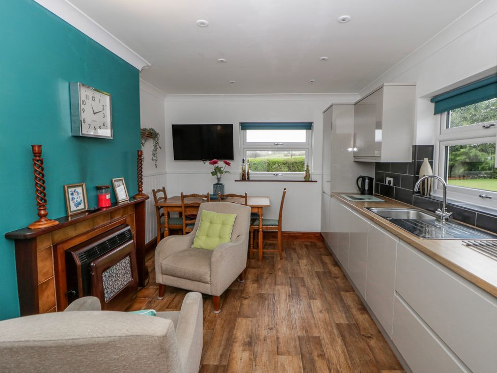 A kitchen with a table and chairs at Blaenywawr near Lampeter