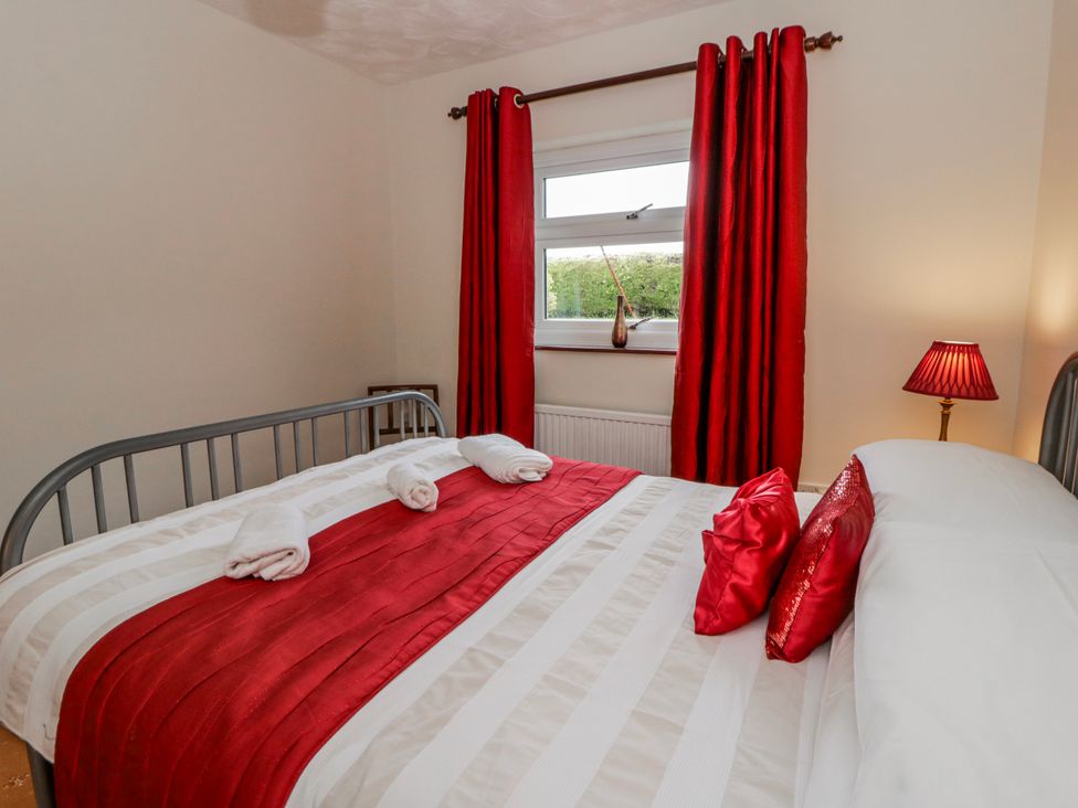 A bedroom with a bed and pillows at Blaenywawr near Lampeter