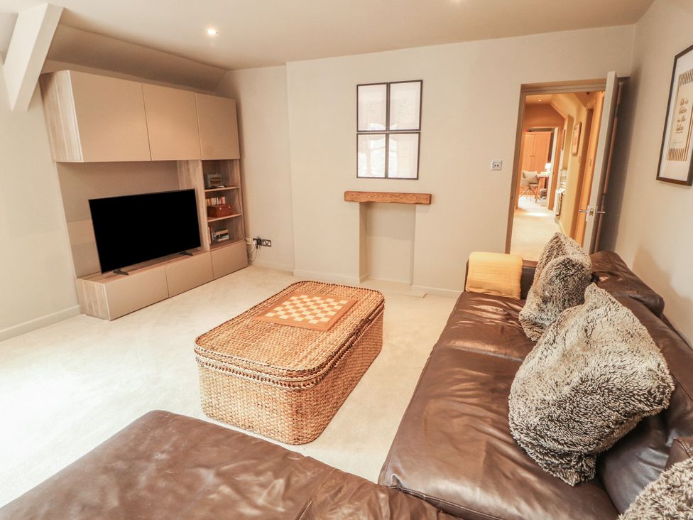 A living room with a sofa and coffee table at Kelsick Heights in Ambleside