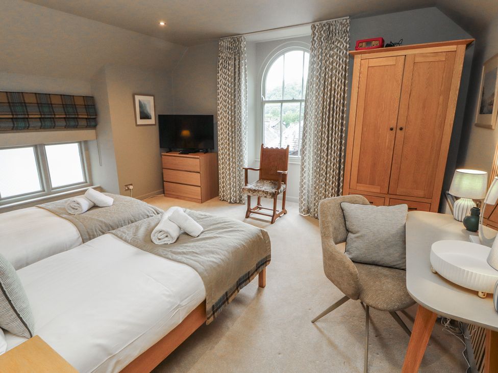 A bedroom with twin beds and a tv at Kelsick Heights in Ambleside