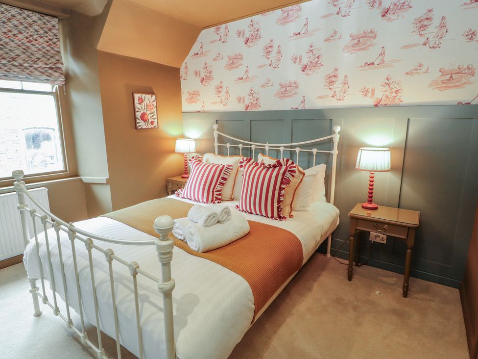 A bedroom with a bed and bedside table at Kelsick Heights in Ambleside