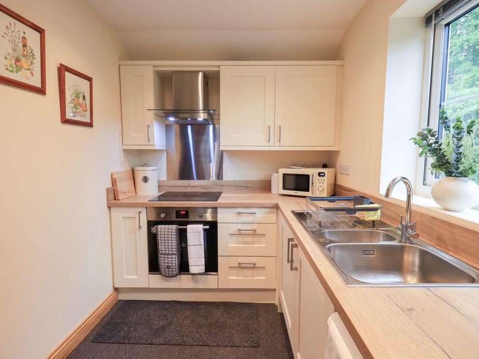 A kitchen with appliances and fixtures at Rose Cottage Crosby on Eden near Carlisle