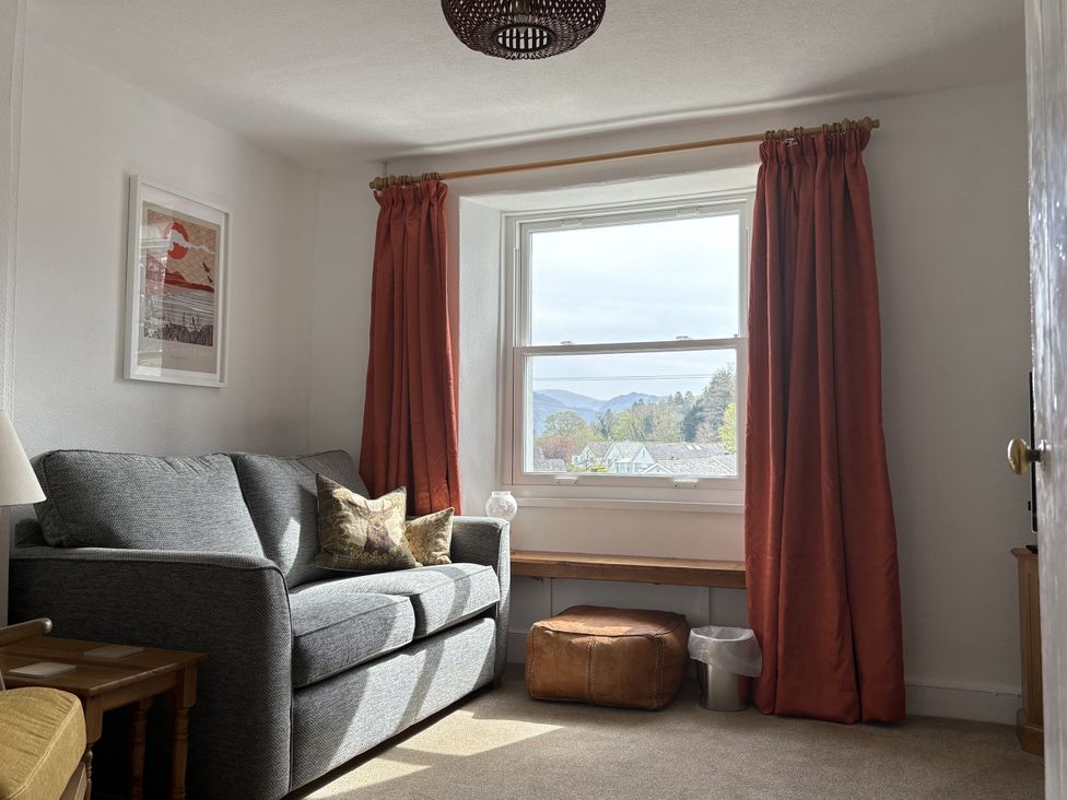 A living room with a sofa and window at Prospect Lodge in Portinscale