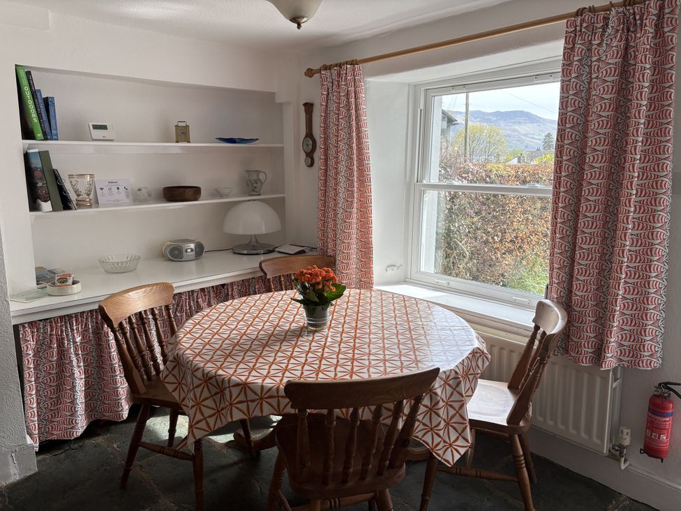 A dining room with a table and chairs at Prospect Lodge in Portinscale