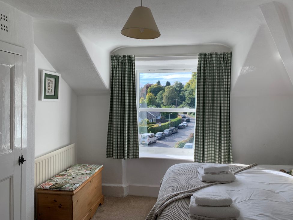 A bedroom with a bed and window at Prospect Lodge in Portinscale