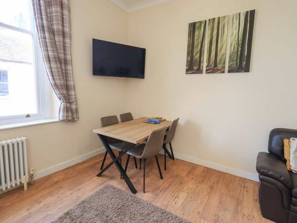 A dining room with a table and chairs at St Johns View in Keswick