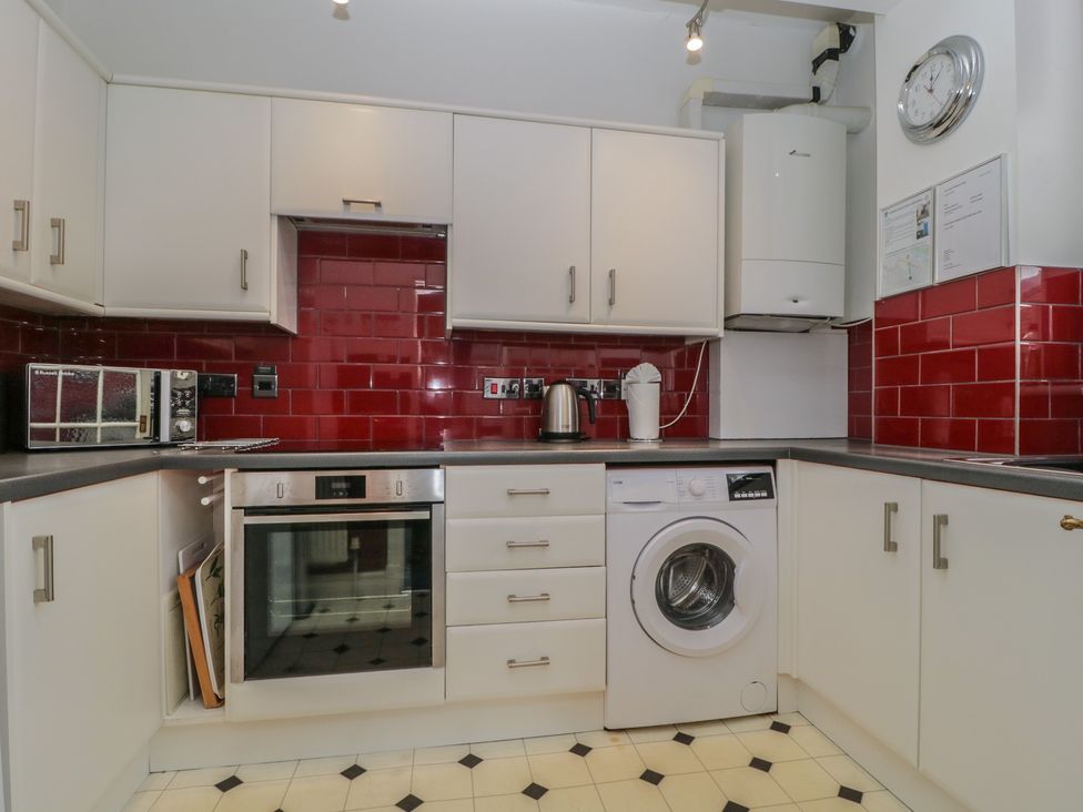 A kitchen with appliances and cabinets at Amba in Keswick