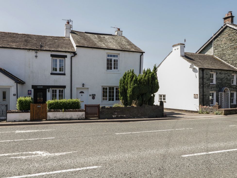A row of houses with a bush in front at Fountain Cottage Keswick
