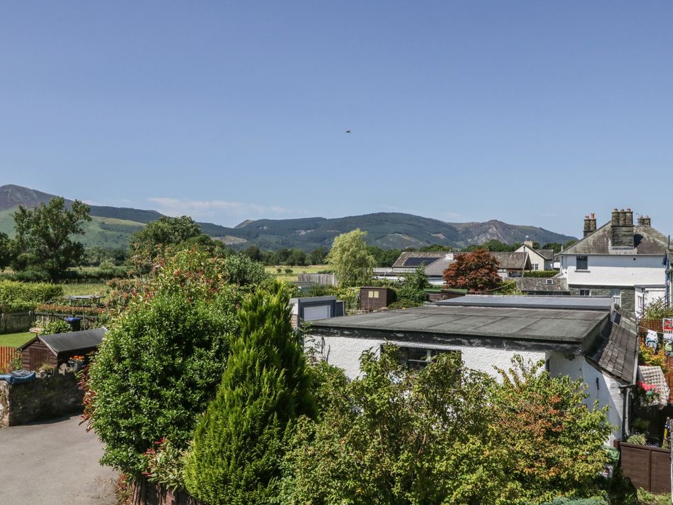 A view of trees and mountains at Fountain Cottage in Keswick