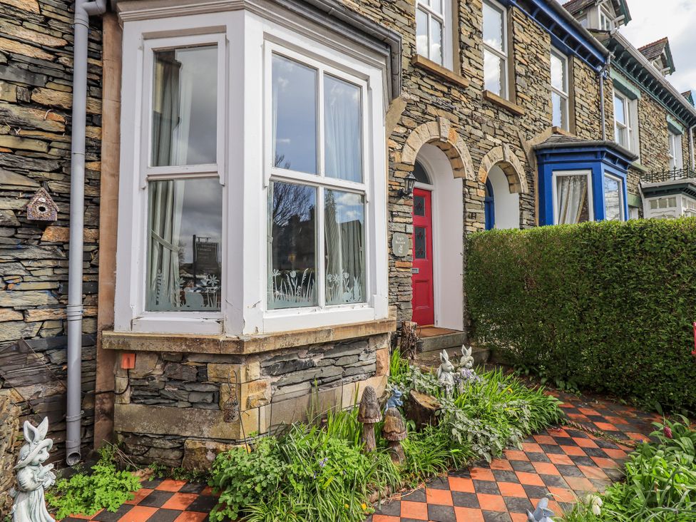 An outdoor view of a house facade with a garden at Ingle Burrow, Windermere